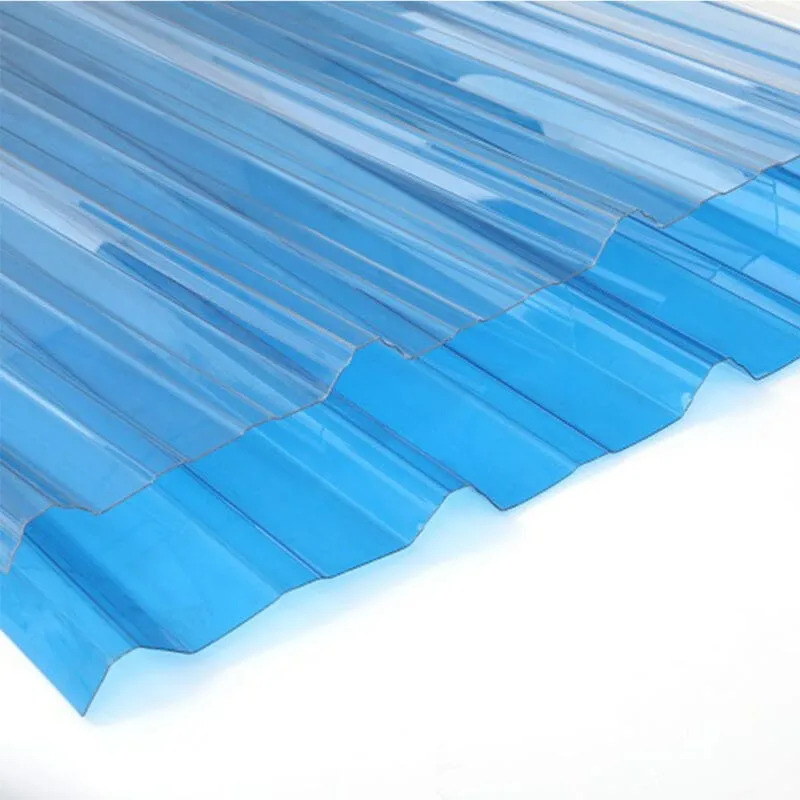 Overlapping blue translucent corrugated polycarbonate sheets showing repeated ridges
