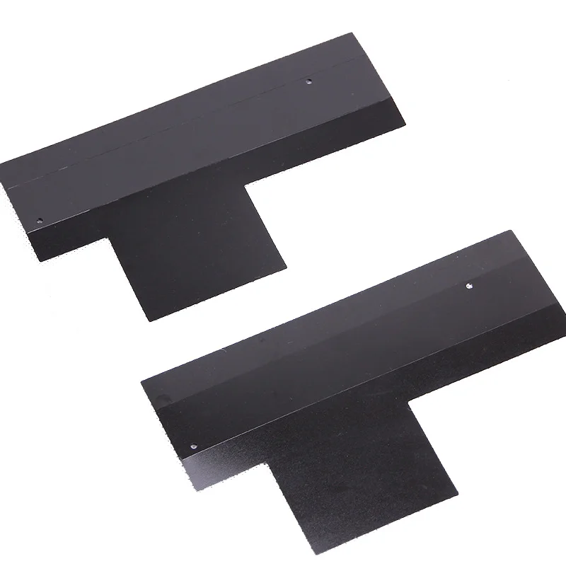Two dark flat fabricated PC panels with notches and small drilled holes
